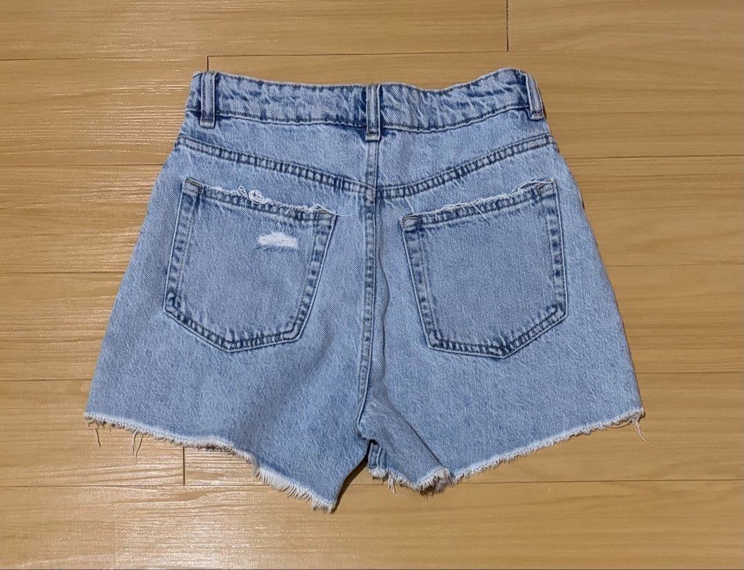 H&M High-Rise Button-Fly Distressed Denim Shorts US 4 (Category: Shorts) located in Quezon City. Submitted by garagesale2026 (Listing ID 1468706559, Image 2). Description: - Preloved - In very good condition - Light wash denim; Frayed hem - Waist: 27".
