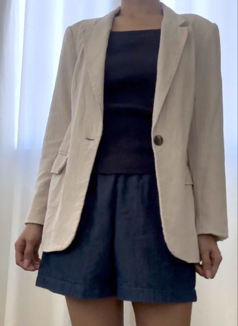 H&M Linen Blazer in Beige (Category: Coats, Jackets and Outerwear) located in Mandaluyong City. Submitted by trishi.trish (Listing ID 1468568306, Image 3). Description: - Brand: H&M - Size: XS - Color: Beige - Closure: Front single button - Pockets: Two functional flap pockets - Lining: Fully lined in white - Measurements: Provided in the photos - Swipe to see when worn photos - In great condition - Fully lined - Material: Linen ane viscose blend