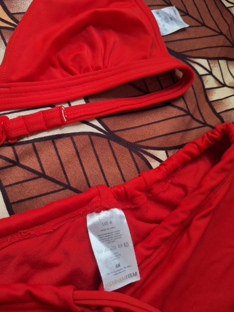 H&M Red Bikini Set Size EUR 38 US 8 (Category: Bikinis & Swimsuits) located in Manila. Submitted by bitna44 (Listing ID 1468562751, Image 2). Description: - Brand: H&M - Color: Bright red - Size: EUR 38 / US 8 (tags attached) - Set includes: Halter neck top and high-waisted bottoms - Details: Adjustable back straps on top; adjustable drawstring sides with metal beads on bottoms - Condition: Brand new, ready for the beach or pool.