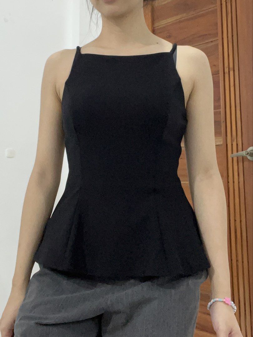 H&M Sleeveless Peplum Top (Category: Sleeveless) located in Quezon City. Submitted by ktmrn (Listing ID 1468670199, Image 3). Description: - Brand: H&M - Color: Classic Black - Design: Square neckline with thin shoulder straps - Fit: Fitted bodice with a flattering flared peplum waist - Style: Sleek and versatile - Pairing: Perfect to match with jeans or trousers for casual or dressed-up occasions worn once.