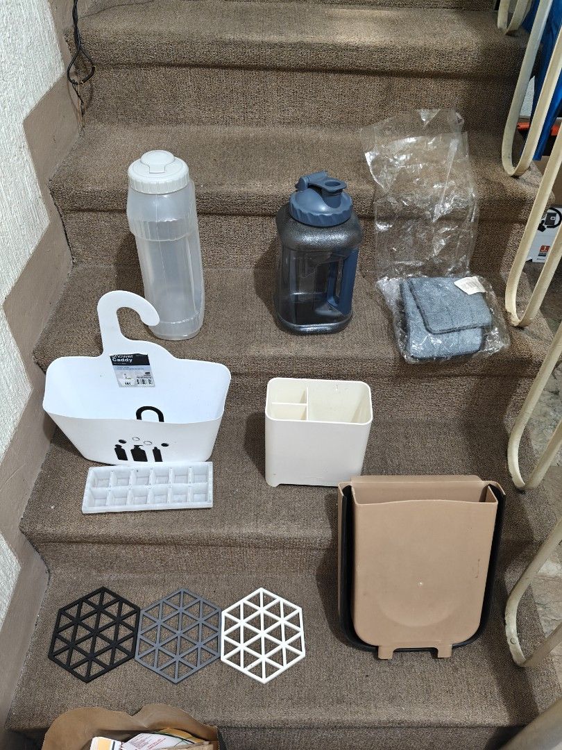 Home and Kitchen Organizer Bundle Water Bottles Caddy Tray Trash Can (Category: Food Organization & Storage) located in Manila. Submitted by kieldulay (Listing ID 1468526038, Image 1). Description: - Decluttering bundle: Take the whole set in one go! - Includes: White shower caddy, 2 large water jugs, collapsible trash bin, desk organizer, ice cube tray, packaged microfiber cloths, 3 hexagonal coasters, and a small mat - Perfect for organizing yo