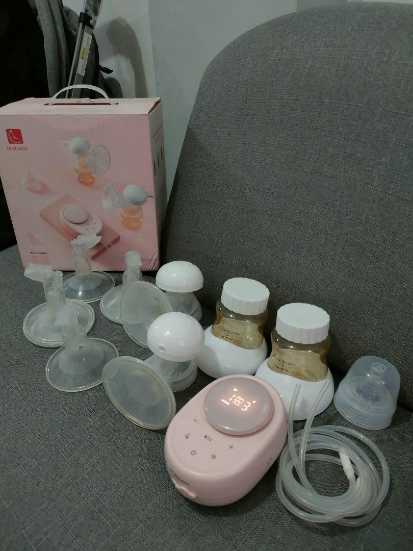Horigen Double Electric Breast Pump with Pink Motor Unit (Category: Breastfeeding & Bottle Feeding) located in Marikina City. Submitted by janddglamcollections (Listing ID 1468669028, Image 1). Description: - Brand/Model: Horigen Wondermore Double Electric Breast Pump - Condition: Clean, well-maintained, and packed in original storage box - Motor: Pink unit with a clear digital display screen - Includes: Dual tubing, 2 collection bottles with whi