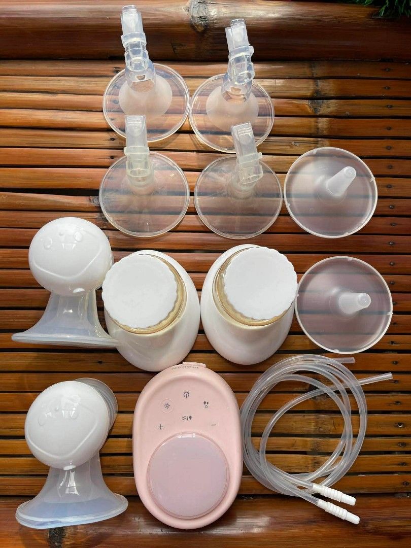 Horigen Double Electric Breast Pump with Pink Motor Unit (Category: Breastfeeding & Bottle Feeding) located in Marikina City. Submitted by janddglamcollections (Listing ID 1468669028, Image 2). Description: - Brand/Model: Horigen Wondermore Double Electric Breast Pump - Condition: Clean, well-maintained, and packed in original storage box - Motor: Pink unit with a clear digital display screen - Includes: Dual tubing, 2 collection bottles with whi
