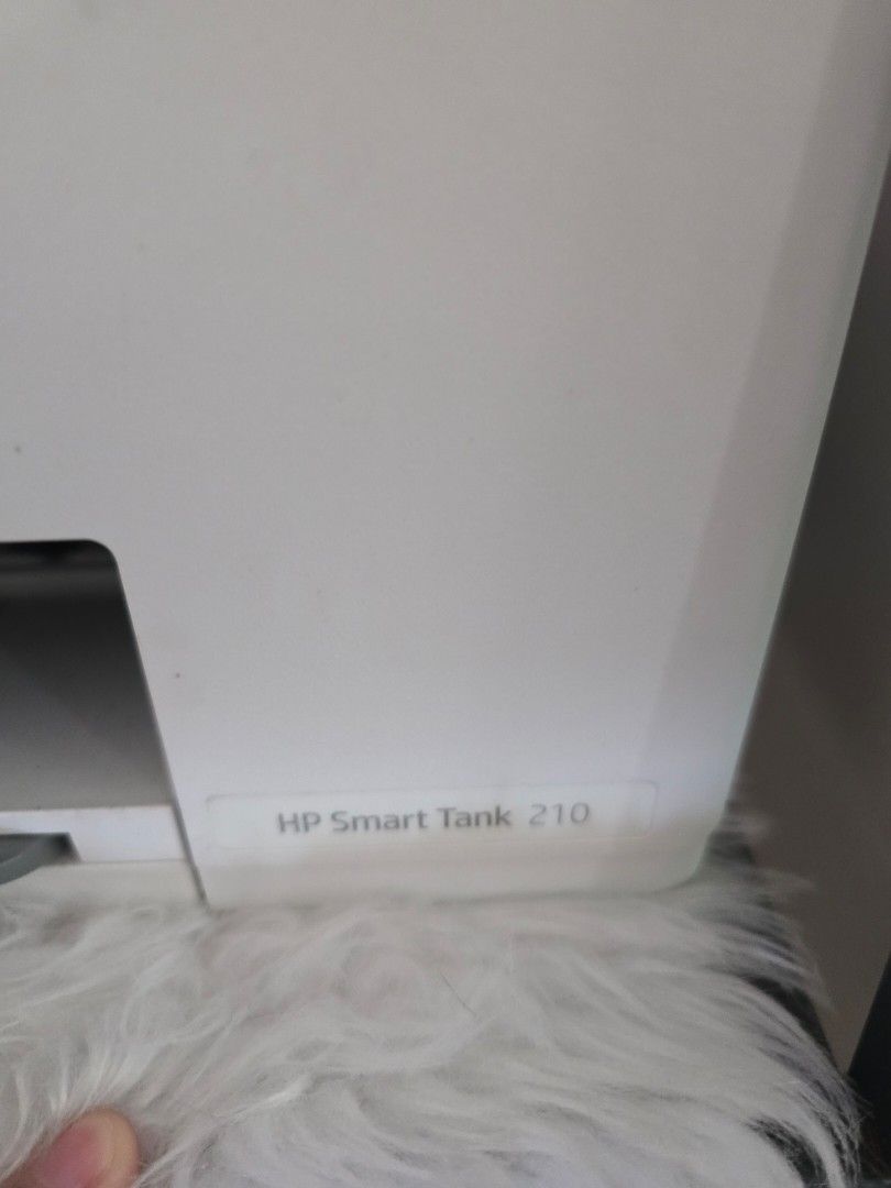 HP Smart Tank 210 All-in-One Printer (Category: Printers, Scanners & Copiers) located in Quezon City. Submitted by bon00 (Listing ID 1468562763, Image 2). Description: - Model: HP Smart Tank 210 (White and Dark Grey) - Ink System: Continuous ink tank with front-visible CMYK slots - Design: Compact footprint with paper tray supporting up to 8.5x11 inch paper - Control Panel: Easy-to-use digital display on top - Ideal For: Home offices and school w