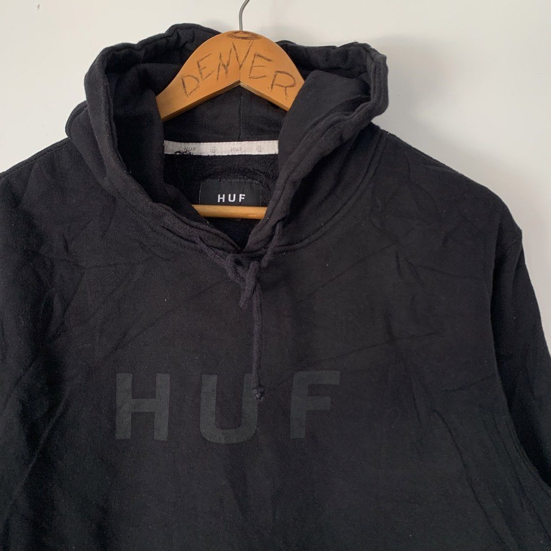 HUF Black Pullover Hoodie with Chest Logo Size M (Category: Hoodies) located in Manila. Submitted by gentleflower-74686a (Listing ID 1468502991, Image 2). Description: - Brand: HUF - 22 x 27 - Color: Black - Size: Medium - Material: 80% Cotton, 20% Polyester - Design: Large tonal HUF logo on chest - Features: Front kangaroo pocket, drawstring hood, ribbed cuffs and hem - Condition: Casual streetwear staple, comfortable fit - Details: Small woven 