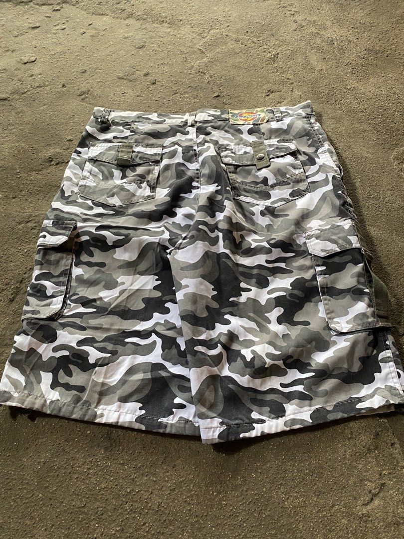 Ice Point Grey Camo Cargo Shorts (Category: Shorts) located in Caloocan City. Submitted by remythrift (Listing ID 1468515272, Image 1). Description: - Brand: Ice Point - Color: Grey and white camouflage - Material: Durable cotton fabric - Pockets: Multiple utility pockets on sides and back - Features: Button closure and belt loops - Style: Casual streetwear, easy to pair with tees or hoodies.