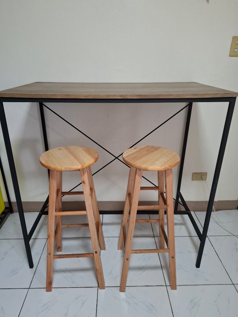 Industrial Style Wooden Bar Table With Two Stools (Category: Tables & Sets) located in Caloocan City. Submitted by kevinaquin23340 (Listing ID 1468531357, Image 2). Description: - Complete 3-piece bar set: 1 wooden top bar table and 2 matching round wooden bar stools - Sturdy black metal frames with X-brace crossbar support on the table for extra stability - Clean, modern design ideal for dining areas, kitchen islands, or breakfast nooks - Standa