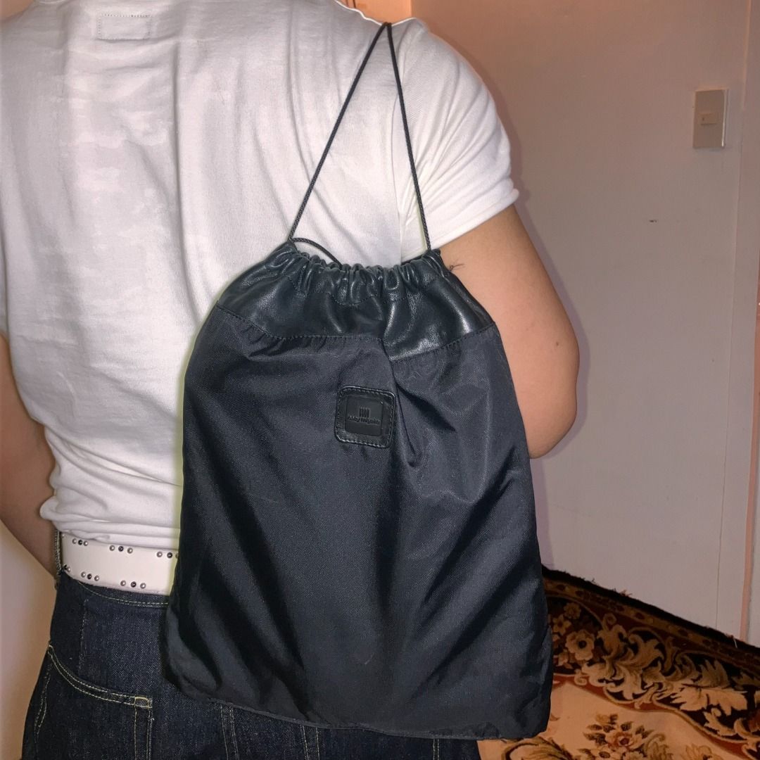 ISSEY MIYAKE Black Nylon & Leather Drawstring Bag (Category: Luxury Bags & Wallets) located in Manila. Submitted by nellyfrustrado (Listing ID 1468586756, Image 1). Description: authentic vintage I.M Issey Miyake drawstring shoulder bag / backpack in black. Designed with a high-grade nylon body and rich genuine leather accents at the top cinch collar, leather base panel, and strap pull-tabs. Features an embossed “I.M Issey Miyake” logo on the fro