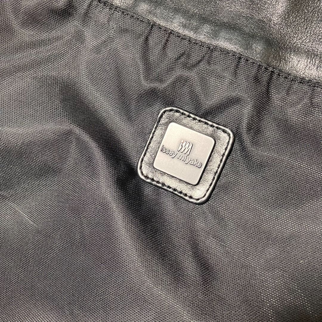 ISSEY MIYAKE Black Nylon & Leather Drawstring Bag (Category: Luxury Bags & Wallets) located in Manila. Submitted by nellyfrustrado (Listing ID 1468586756, Image 2). Description: authentic vintage I.M Issey Miyake drawstring shoulder bag / backpack in black. Designed with a high-grade nylon body and rich genuine leather accents at the top cinch collar, leather base panel, and strap pull-tabs. Features an embossed “I.M Issey Miyake” logo on the fro