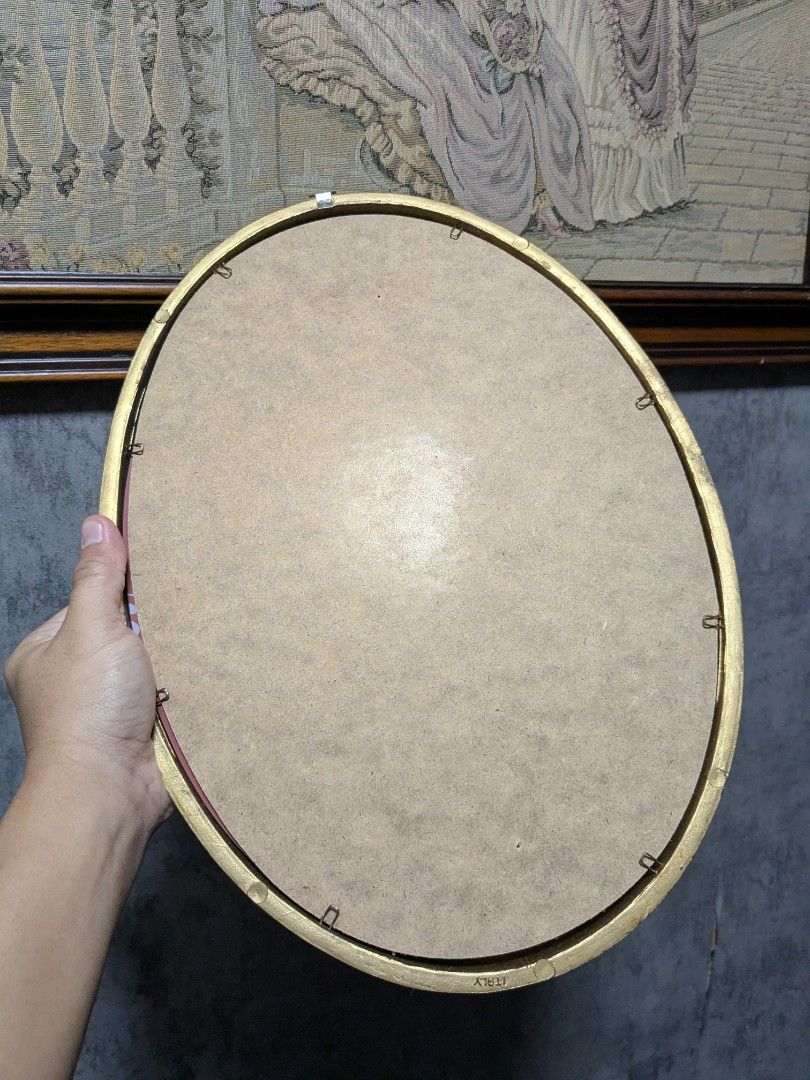 Italian Oval Wall Mirror Rustic Gold Tilt Frame (Category: Vintage Collectibles) located in Makati City. Submitted by thepatentedmill.ph (Listing ID 1468548544, Image 2). Description: - Italian Oval Wall Mirror Rustic Gold Gilt Plastic Frame - Size: 11x15 Inches - Made in Italy - Like New Condition - Price: 2,500.00 RFS: Decluttering.