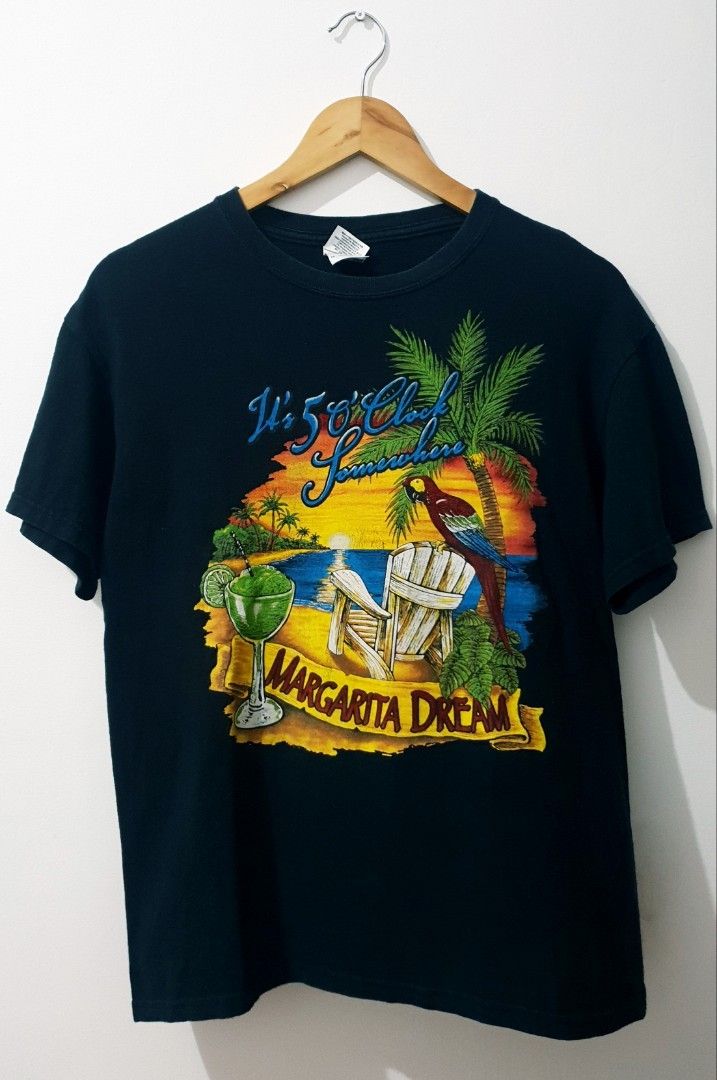 It's 5 O'Clock Somewhere Margarita Dream (Category: Tshirts & Polo Shirts ) located in Taguig. Submitted by wethrifting2021 (Listing ID 1468662875, Image 1). Description: Item: Its 5 Oclock Somewhere (Margarita Dream)🔥 Size: Gildan Heavy Cotton (M) Width: 19.5 Length: 26 Condition: Excellent Issue: Crack print, Paint stain on back SWIPE MORE DETAILS. DM to purchase 📩.