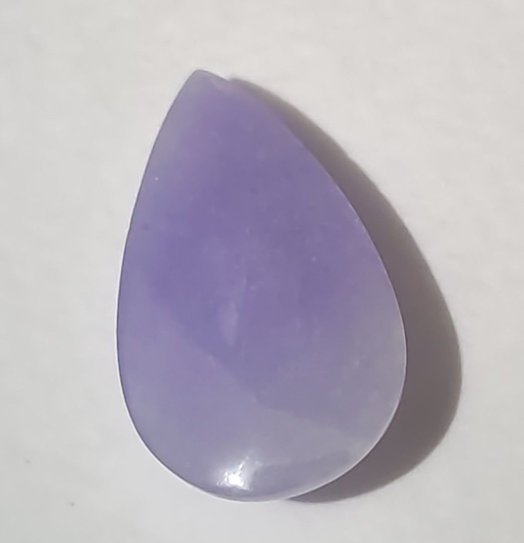 Jadeite pear cut loose cabochon (Category: Precious Stones) located in Bacoor. Submitted by jadeitemaster (Listing ID 1468650616, Image 3). Description: This is a rare, lavander pear cut or tear drop shape. Intense purple or lavander color under natural light. 3.2grams approximately 16carats Natural type A, with certificate. Will be gorgeous when set in 18k ring or pendant..