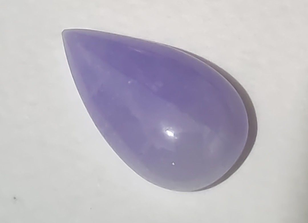 Jadeite pear cut loose cabochon (Category: Precious Stones) located in Bacoor. Submitted by jadeitemaster (Listing ID 1468650616, Image 1). Description: This is a rare, lavander pear cut or tear drop shape. Intense purple or lavander color under natural light. 3.2grams approximately 16carats Natural type A, with certificate. Will be gorgeous when set in 18k ring or pendant..