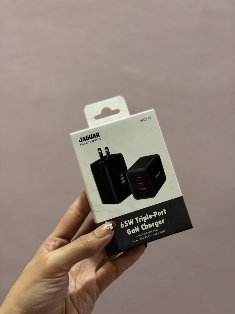 Jaguar 65W Triple-Port Adaptor (Category: Cables & Adaptors) located in Dasmarinas. Submitted by maarryyaannnn (Listing ID 1468707320, Image 1). Description: - Brand: Jaguar Electronics - Model: WCP12 - Power Output: 65W Ultra-Fast Charging with Smart PPS Technology - Ports: Dual USB-C and Single USB-A (Triple-Port) - Design: Compact with foldable plug, easy for travel - Condition: Brand new in original packaging.