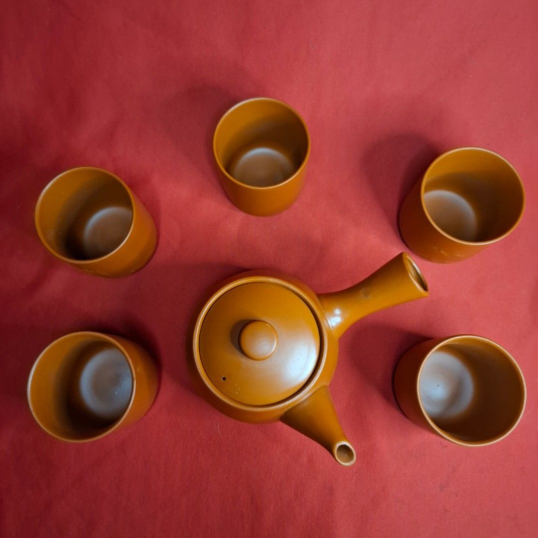 Japanese Kyusu Teapot Set with Five Teacups (Category: Coffee & Tea Tableware) located in Mandaluyong City. Submitted by edward123_andren (Listing ID 1468708073, Image 3). Description: - Traditional Japanese clay tea set in a rich terracotta brown finish - Includes one kyusu side-handle teapot and five matching teacups - Compact size ideal for solo brewing or small gatherings - Perfect for authentic green tea or matcha sessions.