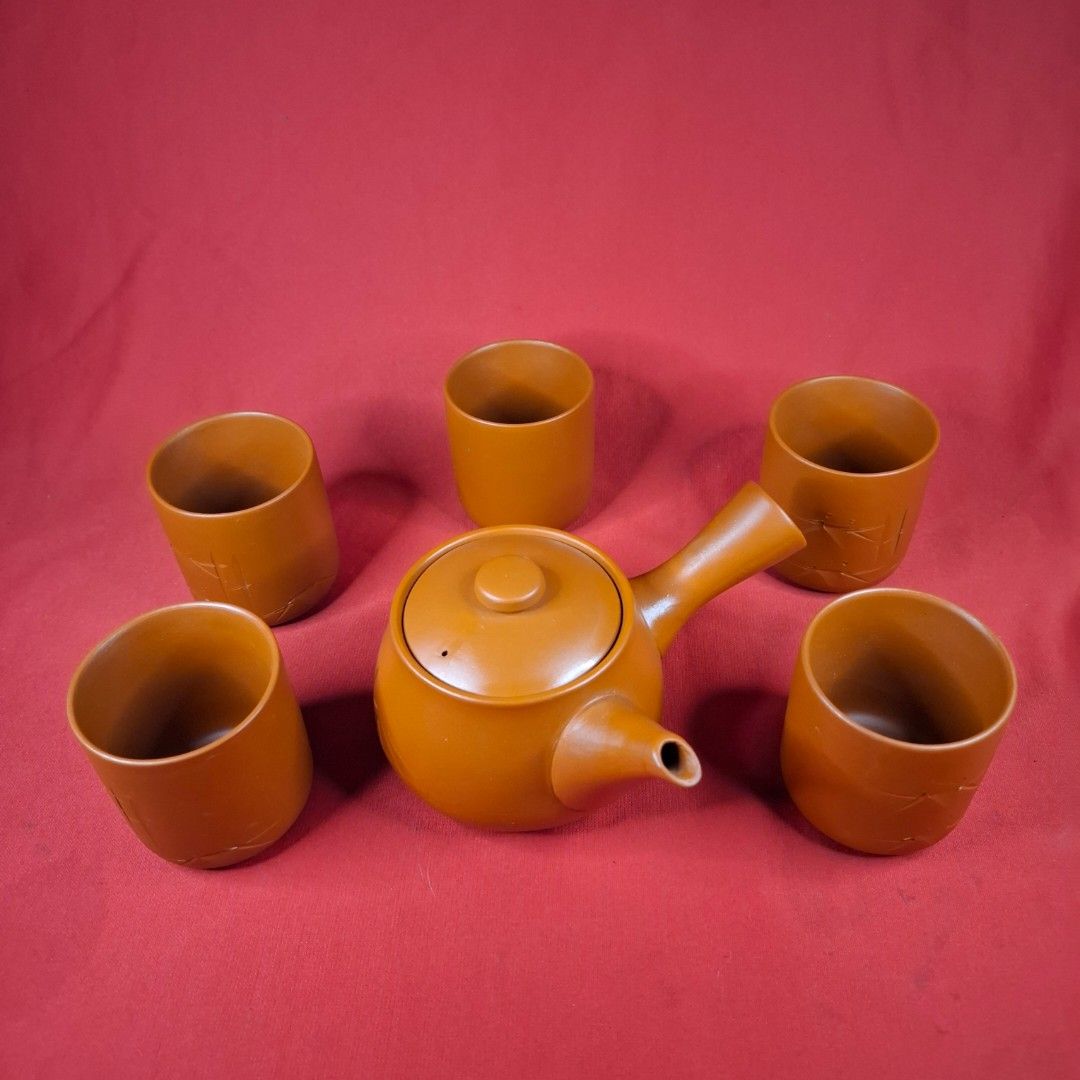 Japanese Kyusu Teapot Set with Five Teacups (Category: Coffee & Tea Tableware) located in Mandaluyong City. Submitted by edward123_andren (Listing ID 1468708073, Image 2). Description: - Traditional Japanese clay tea set in a rich terracotta brown finish - Includes one kyusu side-handle teapot and five matching teacups - Compact size ideal for solo brewing or small gatherings - Perfect for authentic green tea or matcha sessions.