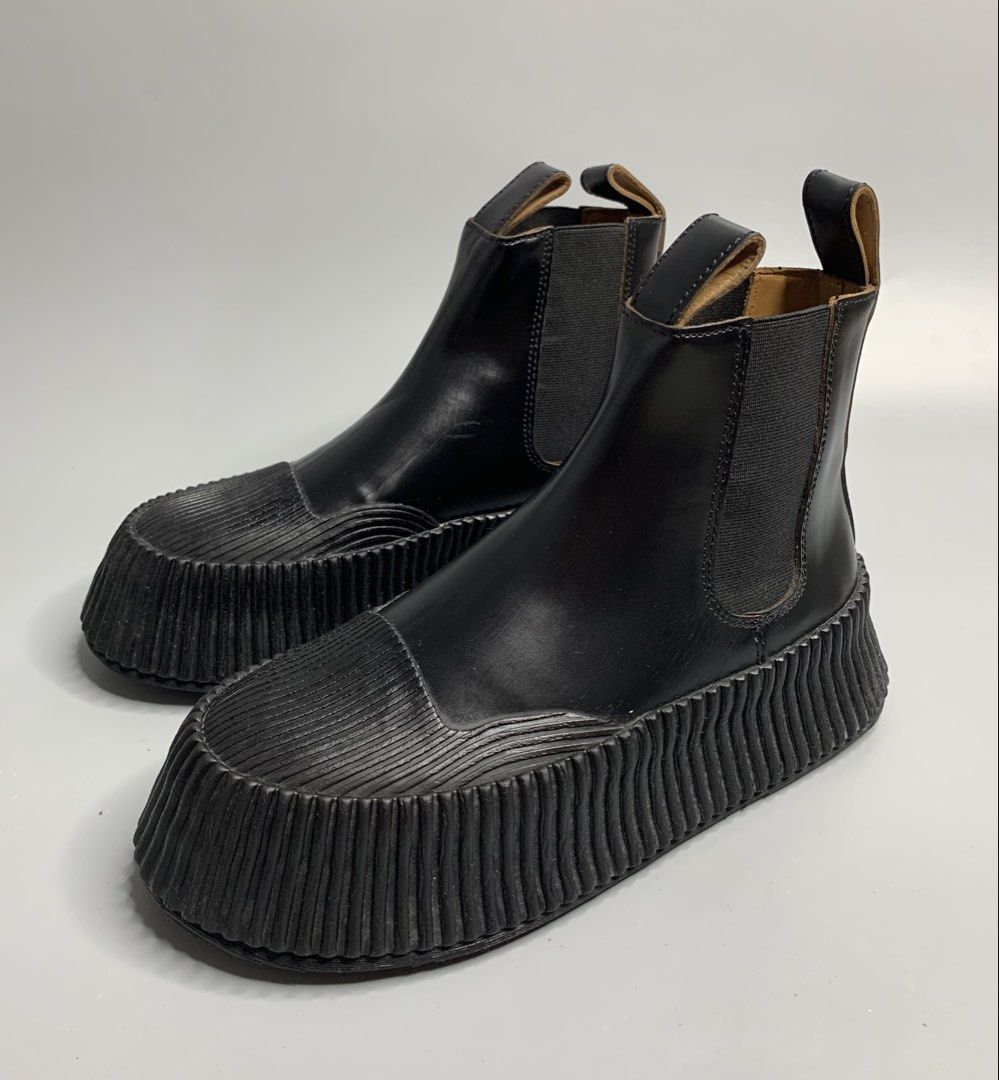 Jil Sander (Category: Boots) located in Binan City. Submitted by hybrid_archival_theory (Listing ID 1468663297, Image 2). Description: Jil Sander Vulcanized Chelsea Boots Womens Size- 35 Made In Spain Actually Never Been Used •No Inclusions •Pair Only •Press Marks Scratch Due To Storage Left Part of the Boots •Please Check Detailed Photos Posted For Your Reference Thankyou!!! • Jil Sander Vulcanised Leather Platform Chelsea Boots (also known as t