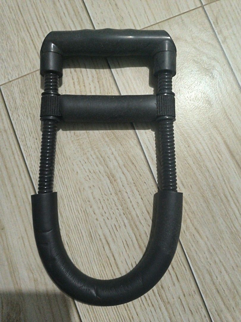 Joerex Be Active Heavy Spring Exercise Power Twister (Category: Cardio & Fitness Machines) located in Manila. Submitted by chayieinkie (Listing ID 1468706726, Image 2). Description: - Brand/Model: Joerex Be Active Fitness Equipment - Color: Sleek Black - Target Areas: Chest, arms, and shoulders - Build: Sturdy plastic and foam construction with heavy-duty dual steel springs - Comfort: Padded handles and a secure middle grip - Storage: Compact des