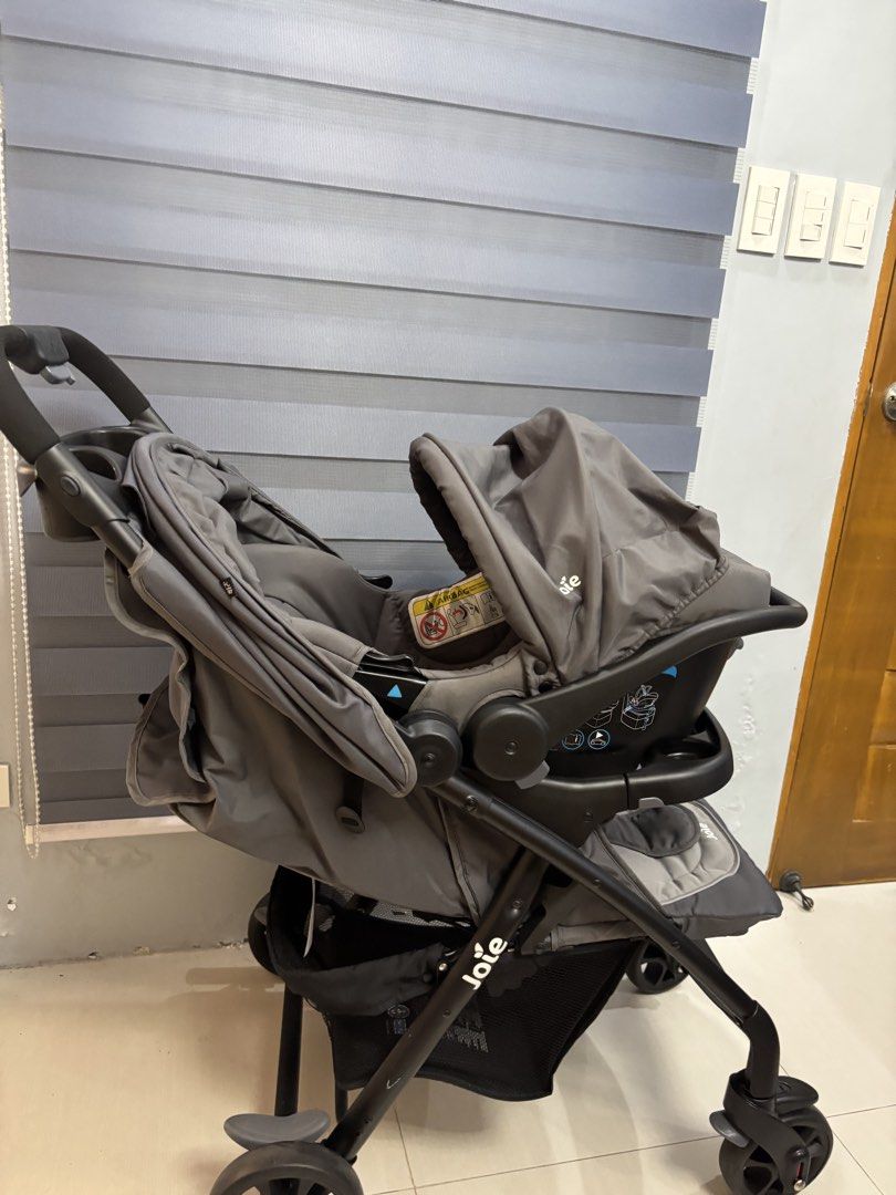 Joie Grey Stroller with Infant Car Seat (Category: Strollers) located in Bulacan. Submitted by xpkim (Listing ID 1468551778, Image 1). Description: - Complete Joie travel system including stroller and matching infant car seat - Neutral grey fabric suitable for boys or girls - Convenient built-in parent tray with cup holders - Adjustable canopy for sun protection - Spacious storage basket underneath for bags and essentials - Used only several time