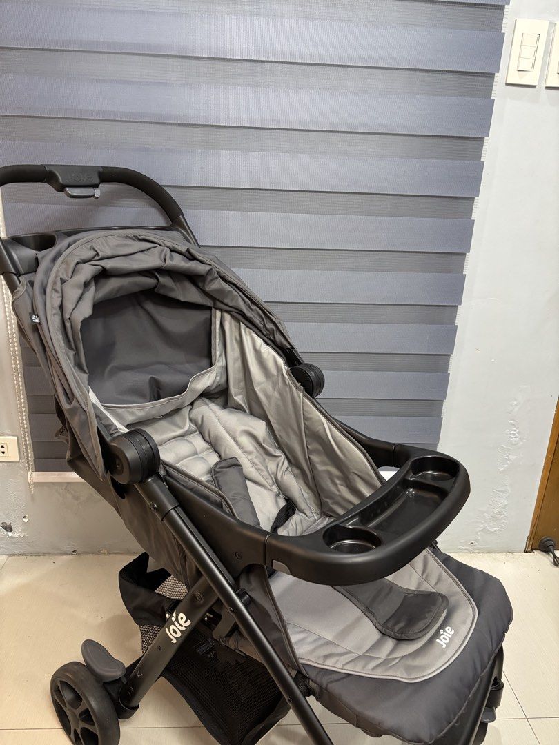Joie Grey Stroller with Infant Car Seat (Category: Strollers) located in Bulacan. Submitted by xpkim (Listing ID 1468551778, Image 2). Description: - Complete Joie travel system including stroller and matching infant car seat - Neutral grey fabric suitable for boys or girls - Convenient built-in parent tray with cup holders - Adjustable canopy for sun protection - Spacious storage basket underneath for bags and essentials - Used only several time