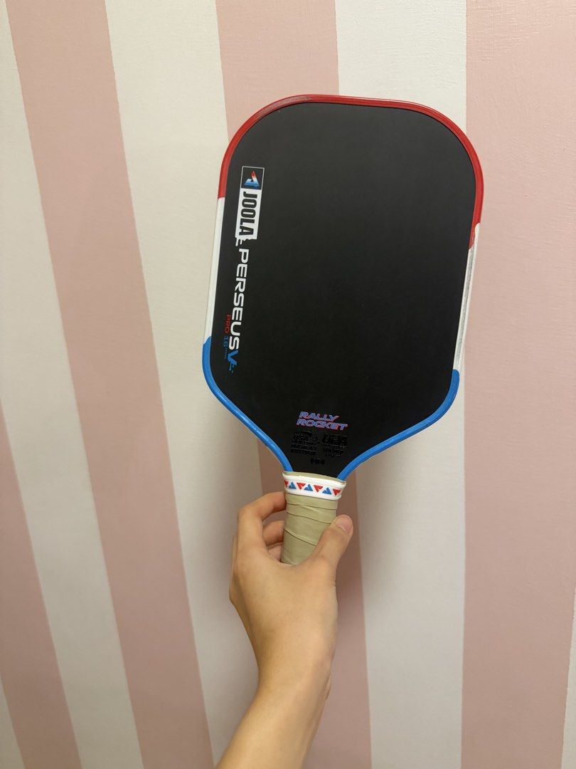JOOLA Perseus V Pro 16mm Pickleball Paddle Pops Edition (Category: Racket and Ball Sports) located in Makati City. Submitted by onlineshopper21 (Listing ID 1468667438, Image 2). Description: JOOLA Perseus Pro 16mm (Pops Series) Inclusions: Comes with the matching popsicle cover, original plastic packaging and box Condition: Well-maintained Bought from Picklexchange Pampanga.