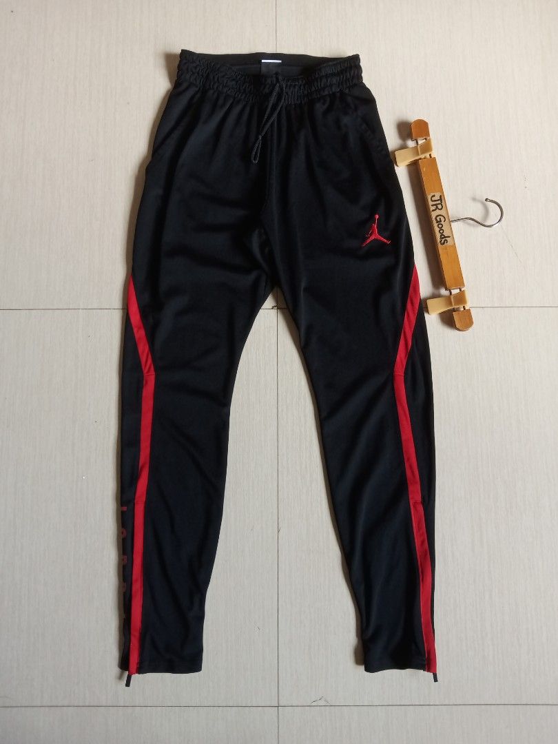 Jordan Dri-FIT Black Red Track Pants (Category: Joggers) located in Tanay. Submitted by jrgoods (Listing ID 1468553723, Image 2). Description: Jordan Small men's Waistline 26-30 Length 38.5 Good as new condition 1299+ship Tanay Rizal location Shipping Nationwide - Material: Nike Dri-FIT technology to keep you dry and comfortable - Fit: Elastic waistband with adjustable drawstring - Design: Bold Jordan lettering down the leg and classic Jumpman lo