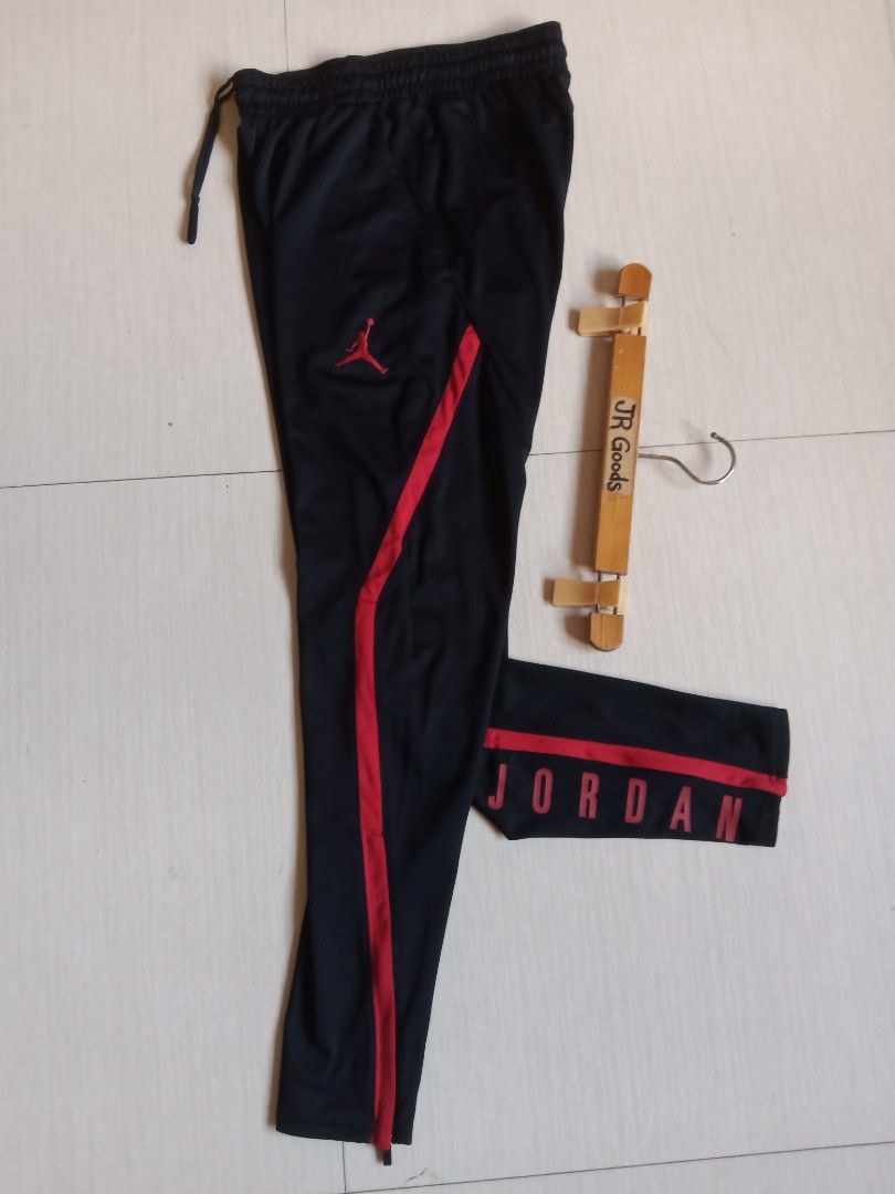 Jordan Dri-FIT Black Red Track Pants (Category: Joggers) located in Tanay. Submitted by jrgoods (Listing ID 1468553723, Image 1). Description: Jordan Small men's Waistline 26-30 Length 38.5 Good as new condition 1299+ship Tanay Rizal location Shipping Nationwide - Material: Nike Dri-FIT technology to keep you dry and comfortable - Fit: Elastic waistband with adjustable drawstring - Design: Bold Jordan lettering down the leg and classic Jumpman lo