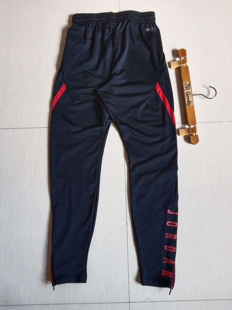 Jordan Dri-FIT Black Red Track Pants (Category: Joggers) located in Tanay. Submitted by jrgoods (Listing ID 1468553723, Image 3). Description: Jordan Small men's Waistline 26-30 Length 38.5 Good as new condition 1299+ship Tanay Rizal location Shipping Nationwide - Material: Nike Dri-FIT technology to keep you dry and comfortable - Fit: Elastic waistband with adjustable drawstring - Design: Bold Jordan lettering down the leg and classic Jumpman lo