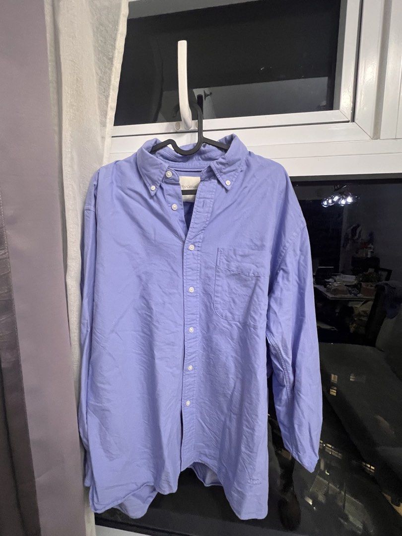 JW Anderson Purple Button Down Shirt (Category: Shirts) located in Manila. Submitted by puredolphin.8fdf1e (Listing ID 1468674137, Image 1). Description: - Brand: JW Anderson, Uniqlo - Color: Light Purple - Style: Long sleeve button-down shirt with classic collar and front chest pocket - Fit: Relaxed fit - Condition: Good, but wrinkled from storage (needs ironing) - Perfect for effortless everyday styling.