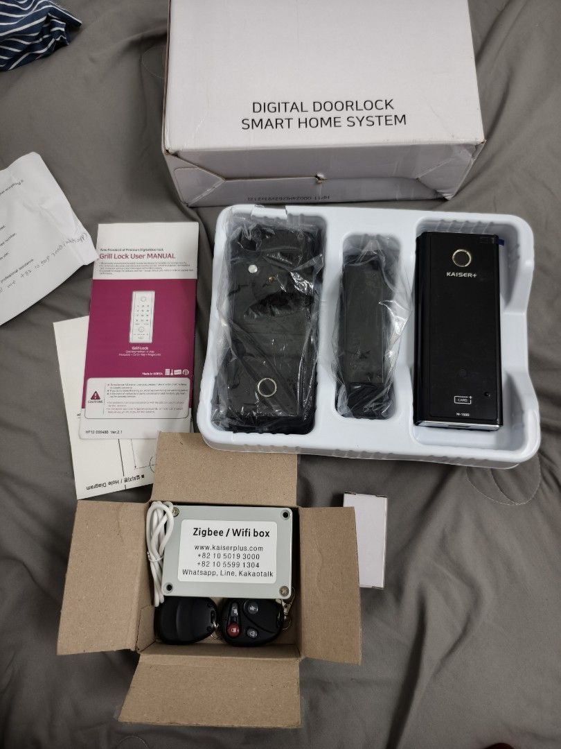 KAISER+ M-1590 Grill Lock Smart Door System (Category: Locks, Doors & Gates) located in Angeles City. Submitted by measaliman02351 (Listing ID 1468573022, Image 1). Description: - Model: KAISER+ M-1590 digital smart door lock system - Condition: Brand new, unopened box with protective plastics still on hardware - Compatibility: Great upgrade for HDB metal gates and grill doors - Inclusions: User manual, Zigbee/Wifi box unit, remote controls, and 