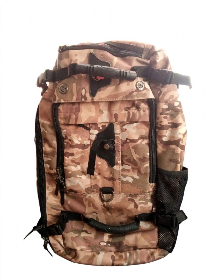 Kaka Multifunctional Camouflage Travel Backpack with Multiple Handles (Category: Backpacks) located in General Trias. Submitted by dwyane09 (Listing ID 1468551016, Image 1). Description: - Earth-tone camouflage design for a rugged look - Heavy-duty construction featuring top and side grab handles - Multiple zipped compartments and front pockets for easy organization - Adjustable shoulder straps with D-rings and side mesh water bottle holder - Com