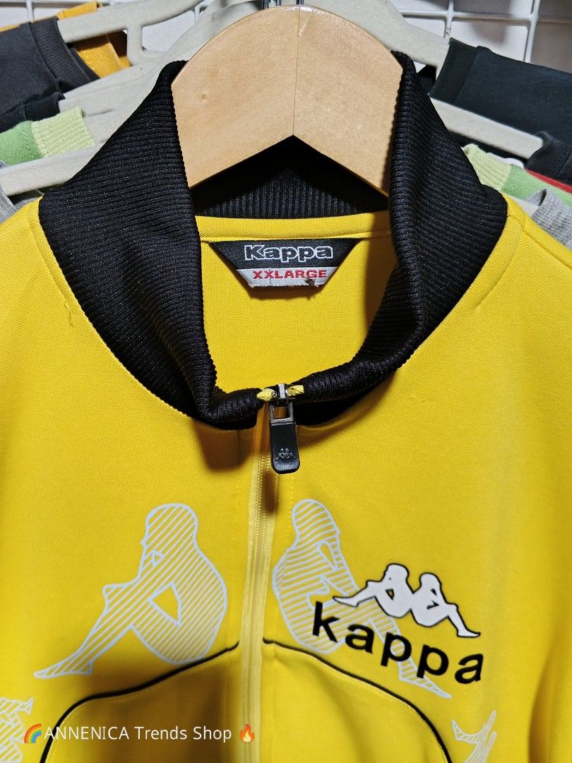 KAPPA TRACK JACKET (Category: Coats, Jackets and Outerwear) located in Bulacan. Submitted by annenicathriftthriftlang (Listing ID 1468516720, Image 2). Description: *KAPPA TRACK JACKET - YELLOW BLACK* *Size XXLARGE on tag - P400 ONLY *DIMES: (Carousel Slide 1 & 2)* - Width: 26 inch pit to pit - Length: 29 inch - Sleeve: 26 inch - Size on tag: XXLARGE - Fit: XL to XXL *DETAILS: (Direct to the point)* - Branded Kappa Omini logo all over print - rar