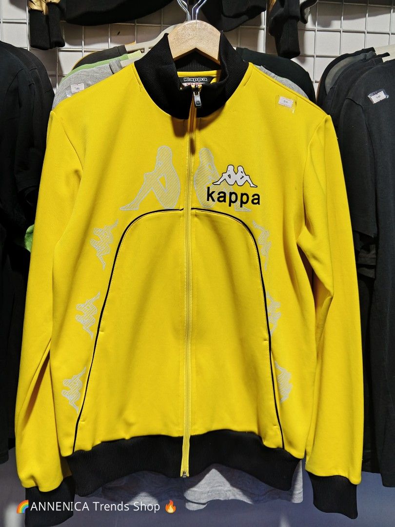 KAPPA TRACK JACKET (Category: Coats, Jackets and Outerwear) located in Bulacan. Submitted by annenicathriftthriftlang (Listing ID 1468516720, Image 1). Description: *KAPPA TRACK JACKET - YELLOW BLACK* *Size XXLARGE on tag - P400 ONLY *DIMES: (Carousel Slide 1 & 2)* - Width: 26 inch pit to pit - Length: 29 inch - Sleeve: 26 inch - Size on tag: XXLARGE - Fit: XL to XXL *DETAILS: (Direct to the point)* - Branded Kappa Omini logo all over print - rar