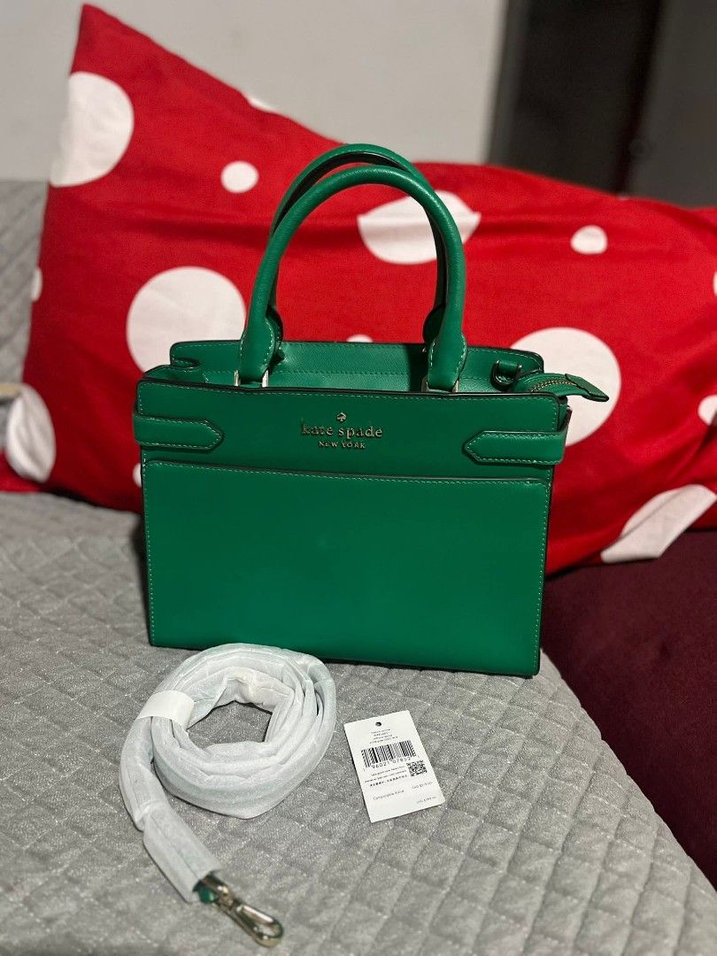 Kate Spade Green Satchel Bag (Category: Shoulder Bags) located in Polomolok. Submitted by legadad94559 (Listing ID 1468553944, Image 1). Description: - Brand: Kate Spade - Style: Medium satchel bag - Color: Vibrant green with gold-toned hardware - Material: Structured leather with fabric-lined interior - Closure: Secure top zip - Features: Dual top handles, interior slip pockets, and protective base feet - Inclusion: Wrapped detachable shoulder s