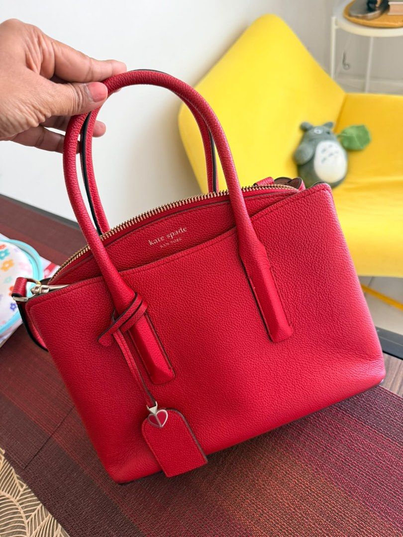 Kate Spade Medium Satchel Red Leather Bag (Category: Tote Bags) located in Quezon City. Submitted by safeflower.a95850 (Listing ID 1468516735, Image 1). Description: - Brand: Kate Spade - Color: Vibrant Red - Material: Genuine Leather - Hardware: Gold-tone - Closure: Zip top - Straps: Dual top handles & detachable shoulder strap - Interior: Signature fabric lining with zip and slip pockets - Extras: Original care card and store tags included - Co