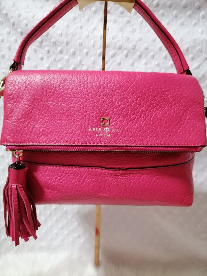 Kate Spade Pebbled Leather 2-Way Bag (Category: Cross-body Bags) located in Butuan. Submitted by az-branded.items (Listing ID 1468593445, Image 2). Description: Size: W 12" x L 77" Dual top detachable shoulder strap Fold over flap Hot pink color Decorative side tassel Gold-toned hardware Selected from Korea bale.