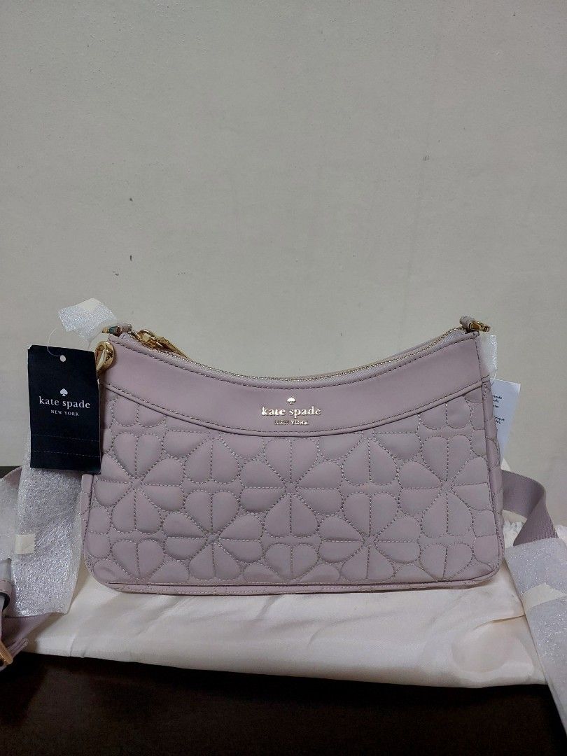 Kate Spade Spade Flower Quilted Shoulder Bag (Category: Luxury Bags & Wallets) located in Manila. Submitted by newdeer.eaa070 (Listing ID 1468647864, Image 1). Description: - Brand: Kate Spade - Color: Pink - Material & Design: Quilted with signature spade flower stitching pattern - Hardware: Gold-toned with subtle front logo lettering - Closure: Secure top zipper - Inclusions: Brand new with attached tags and protective dust bag included.