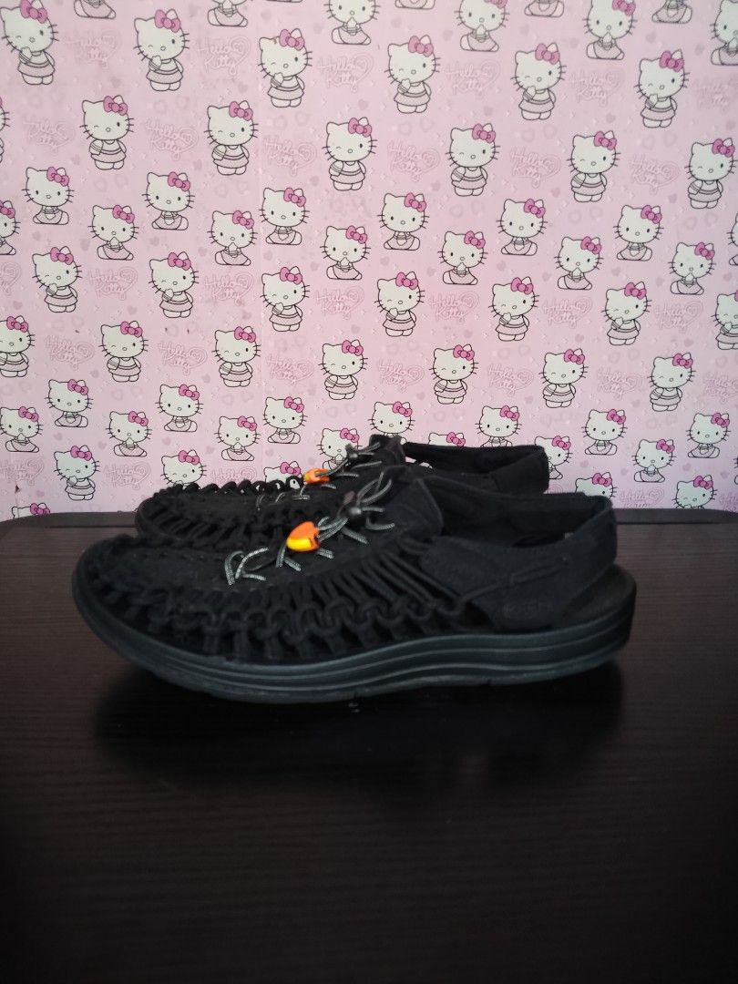 Keen Uneek Black Sandals (Category: Slippers & Slides) located in San Jose del Monte. Submitted by azetor (Listing ID 1468619912, Image 1). Description: - Item: Keen Uneek Sandals - Color: Black with vibrant orange toggle detail - Design: Unique interlocking cord construction with secure open heel strap - Fit & Closure: Adjustable bungee lace system for a customized, comfortable fit - Sole: Durable rubber outsole built for reliable traction - Bes