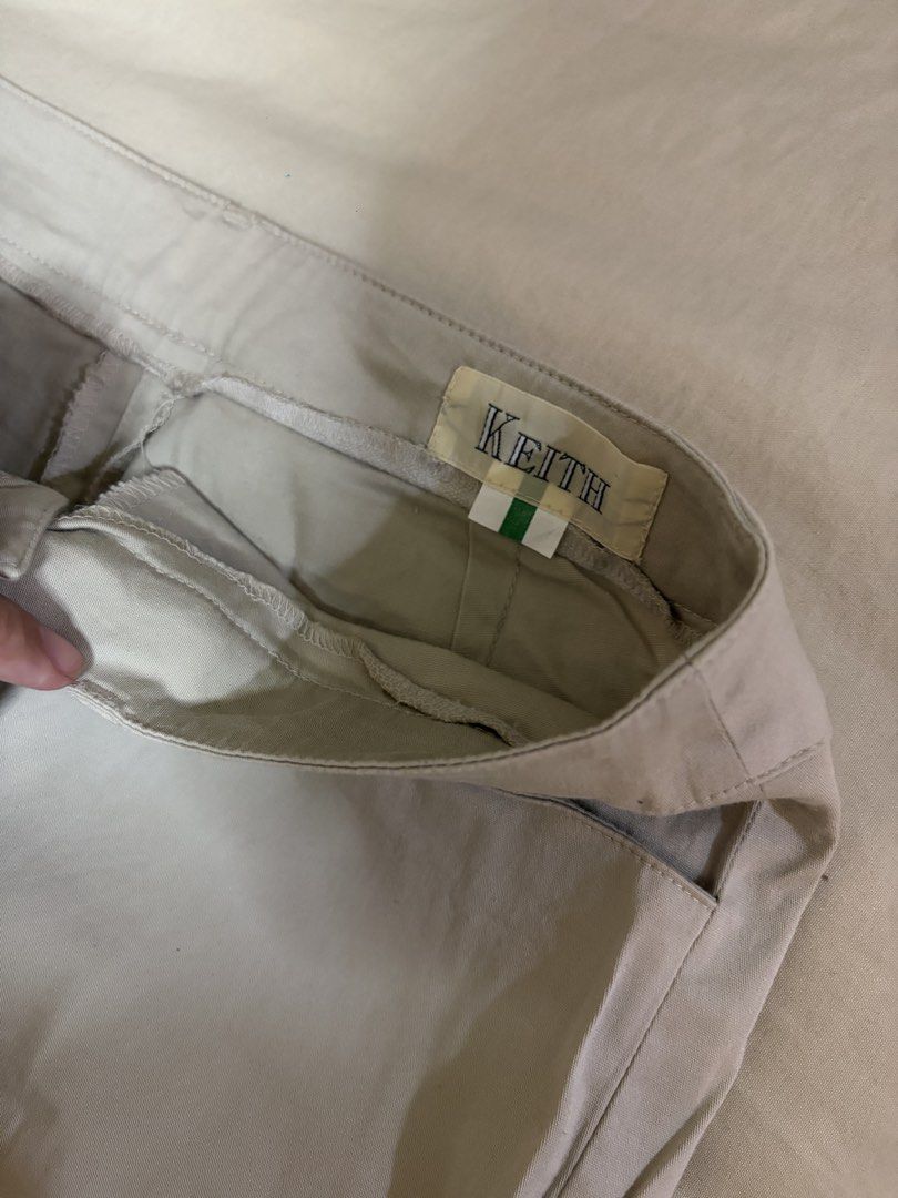 Keith Beige Casual Pants Trousers (Category: Trousers) located in Mandaluyong City. Submitted by afterceej (Listing ID 1468663579, Image 3). Description: - Brand/Model: Keith beige pants - Style: Clean, classic straight-cut trousers - Details: Front button closure with belt loops - Versatility: Solid neutral color, easy to match with any shirt and shoes - Condition: Brand new / Excellent (Ready to ship).