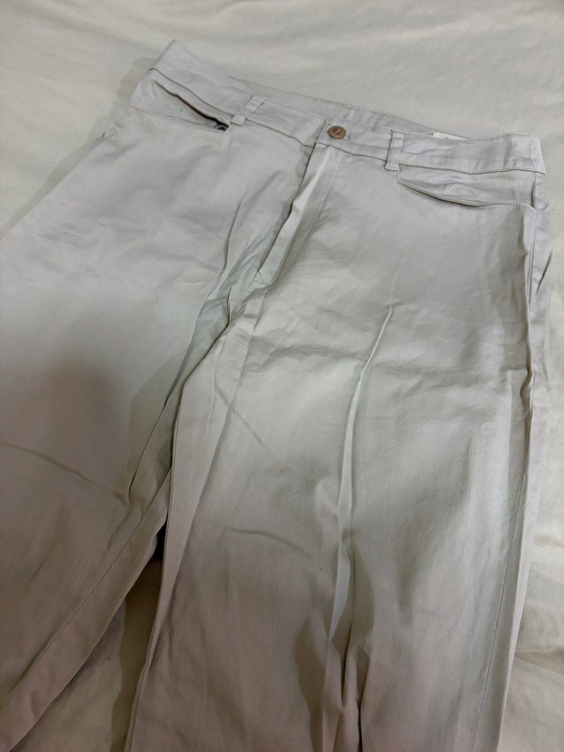 Keith Beige Casual Pants Trousers (Category: Trousers) located in Mandaluyong City. Submitted by afterceej (Listing ID 1468663579, Image 2). Description: - Brand/Model: Keith beige pants - Style: Clean, classic straight-cut trousers - Details: Front button closure with belt loops - Versatility: Solid neutral color, easy to match with any shirt and shoes - Condition: Brand new / Excellent (Ready to ship).
