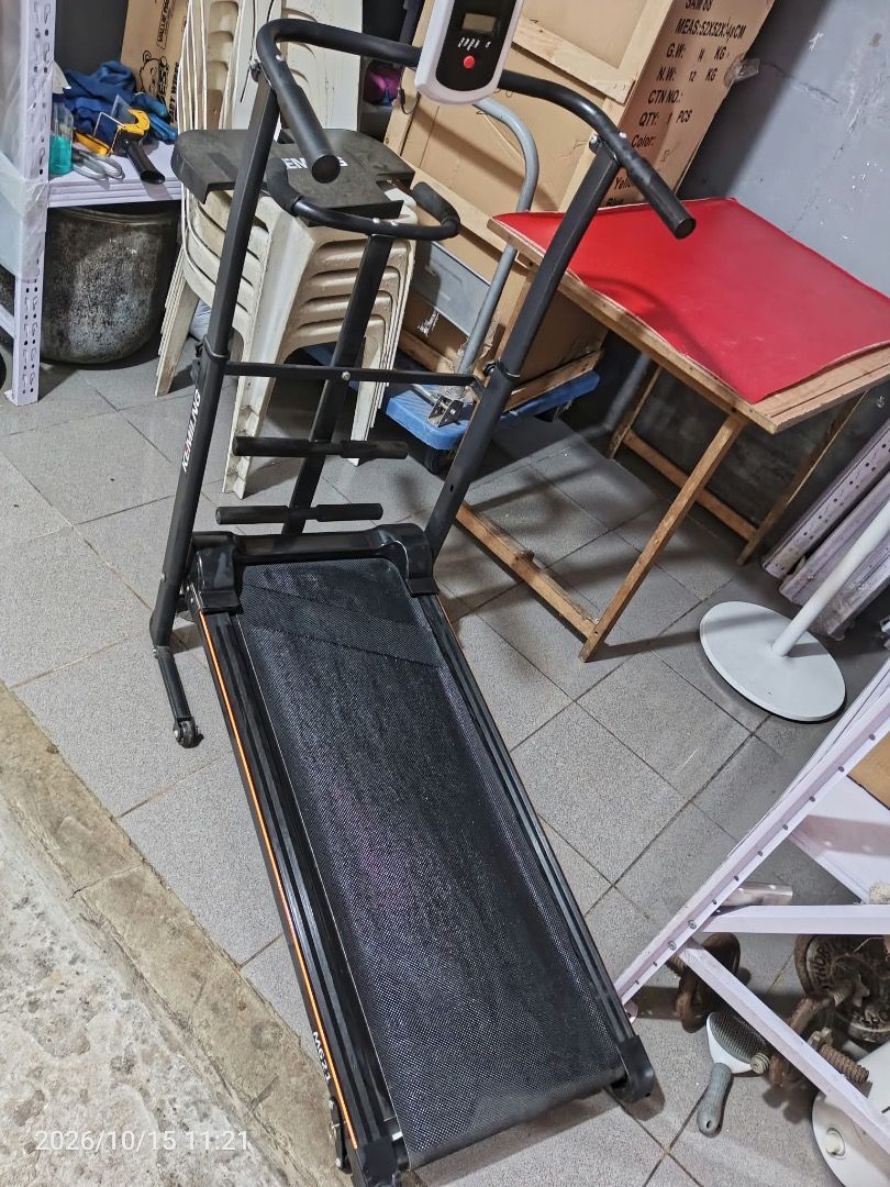 Kemilng Black Folding Manual Treadmill (Category: Cardio & Fitness Machines) located in Cainta. Submitted by janinayy29 (Listing ID 1468501972, Image 2). Description: - Color: Sleek black with an eye-catching orange stripe accent - Compact & Space-Saving: Ideal for home workouts and easy storage with a built-in folding mechanism - Tracking & Support: Equipped with a built-in front monitor panel and side handlebars - Durable Build: Sturdy metal co