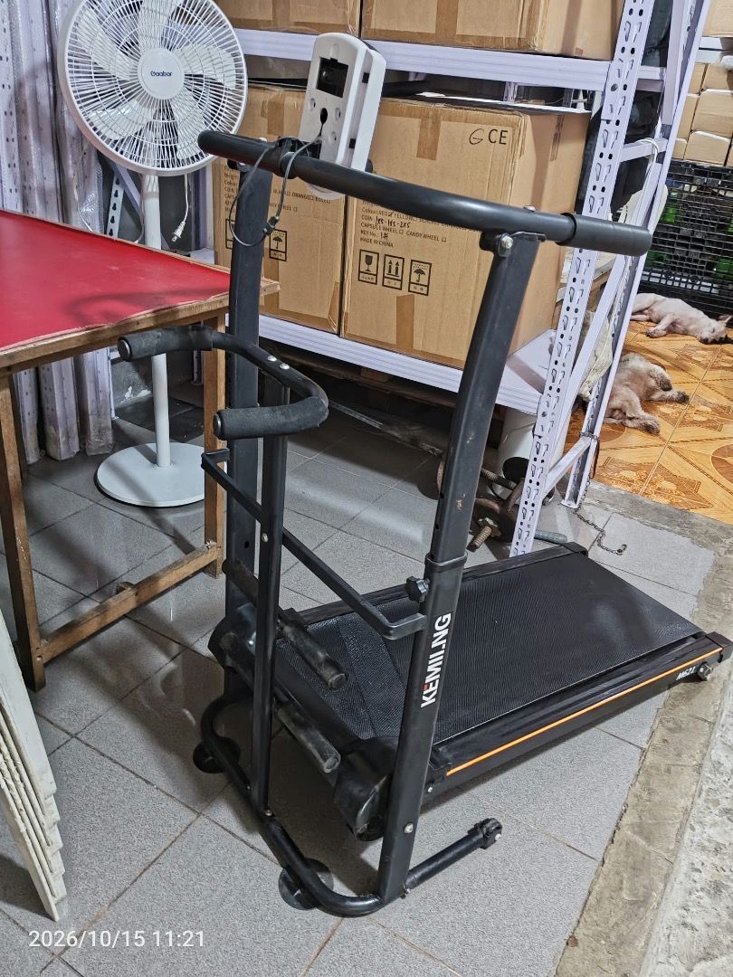 Kemilng Black Folding Manual Treadmill (Category: Cardio & Fitness Machines) located in Cainta. Submitted by janinayy29 (Listing ID 1468501972, Image 1). Description: - Color: Sleek black with an eye-catching orange stripe accent - Compact & Space-Saving: Ideal for home workouts and easy storage with a built-in folding mechanism - Tracking & Support: Equipped with a built-in front monitor panel and side handlebars - Durable Build: Sturdy metal co