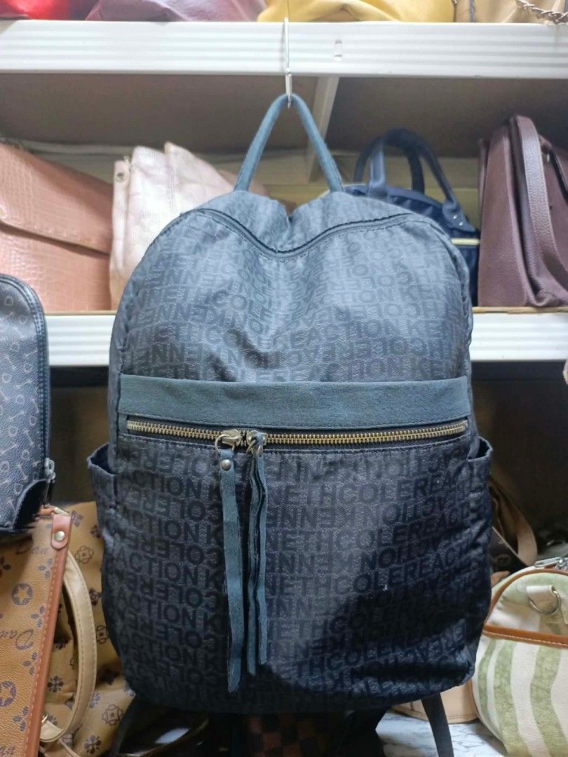Kenneth Cole Reaction Dark Grey Monogram Backpack (Category: Backpacks) located in Manila. Submitted by dei03_diz (Listing ID 1468544369, Image 1). Description: - Brand: Kenneth Cole Reaction - Color: Dark grey with all-over monogram print - Pockets: Front zipper pocket with double fringe pulls + inside zippered compartment - Straps: Top handle and adjustable shoulder straps - Hardware: Dark finish - Perfect for: Daily use, school, or travel - Co