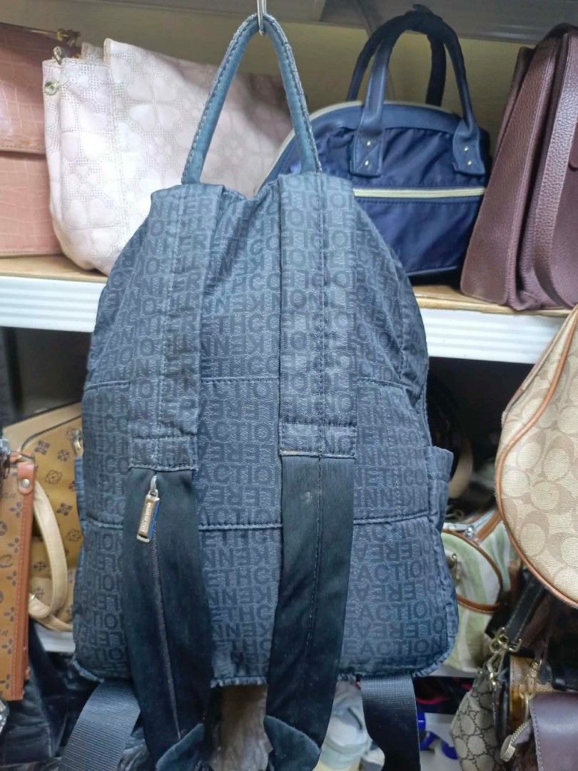 Kenneth Cole Reaction Dark Grey Monogram Backpack (Category: Backpacks) located in Manila. Submitted by dei03_diz (Listing ID 1468544369, Image 2). Description: - Brand: Kenneth Cole Reaction - Color: Dark grey with all-over monogram print - Pockets: Front zipper pocket with double fringe pulls + inside zippered compartment - Straps: Top handle and adjustable shoulder straps - Hardware: Dark finish - Perfect for: Daily use, school, or travel - Co