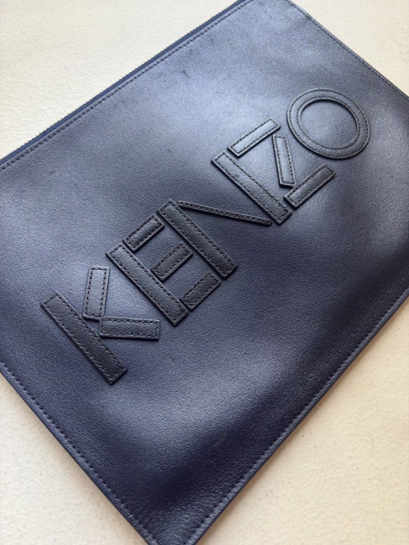 Kenzo All-Leather Flat Clutch Bag (Category: Luxury Bags & Wallets) located in Mandaluyong City. Submitted by wear_your_style (Listing ID 1468541933, Image 2). Description: Store bought for I think ₱16K. This is flat type. I think this is calf skin kaya malambot. Zipper is good. Midnight blue color. The applique “Kenzo” is also leather. Perfect for people na ayaw ng maraming dala. You can use this as a wallet na rin. Approx 11 inches wide and 8 i