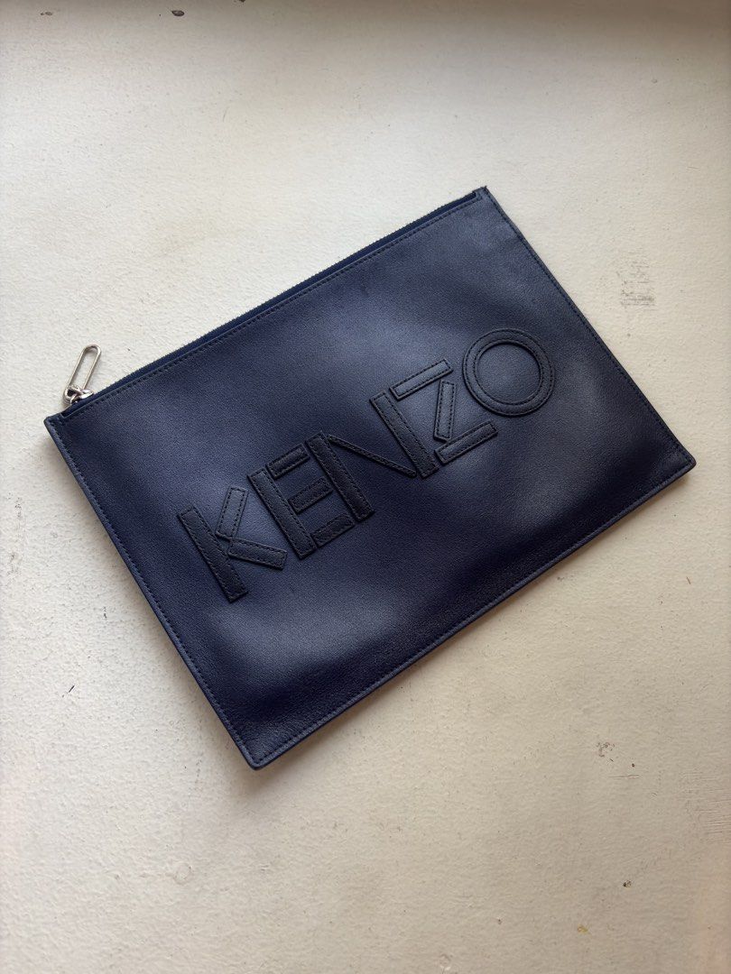 Kenzo All-Leather Flat Clutch Bag (Category: Luxury Bags & Wallets) located in Mandaluyong City. Submitted by wear_your_style (Listing ID 1468541933, Image 1). Description: Store bought for I think ₱16K. This is flat type. I think this is calf skin kaya malambot. Zipper is good. Midnight blue color. The applique “Kenzo” is also leather. Perfect for people na ayaw ng maraming dala. You can use this as a wallet na rin. Approx 11 inches wide and 8 i