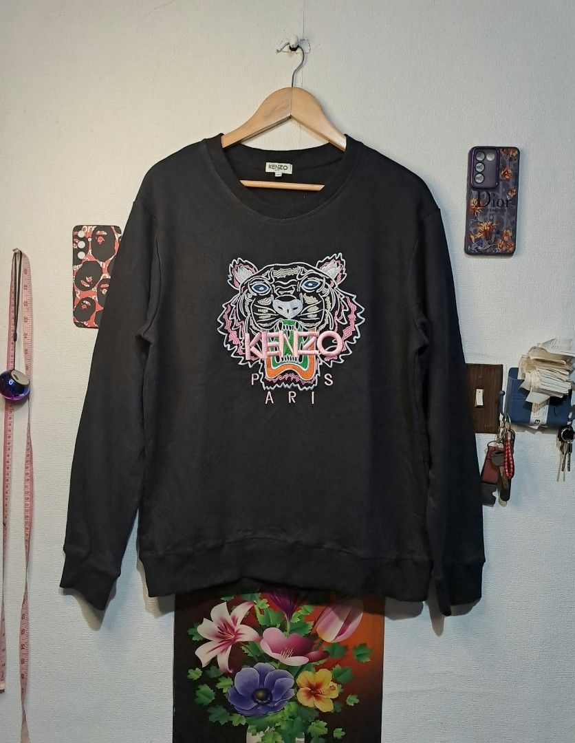 Kenzo Paris Multicolor Embroidered Tiger Logo (Category: Luxury Apparel) located in Manila. Submitted by yaseen_73 (Listing ID 1468710852, Image 1). Description: Authentic Kenzo Paris Tiger Sweatshirt Multicolored Embroidered Tiger Graphic and Paris on the Chest Wearings Size : XXL on Tags Dimensions : Please Refer to the Photo Color Rate : 10/10 Needs Wash Brand New Condition or Best Offer Courier : J&T Lalamove MOP : G C A S H B A N K T R A N S