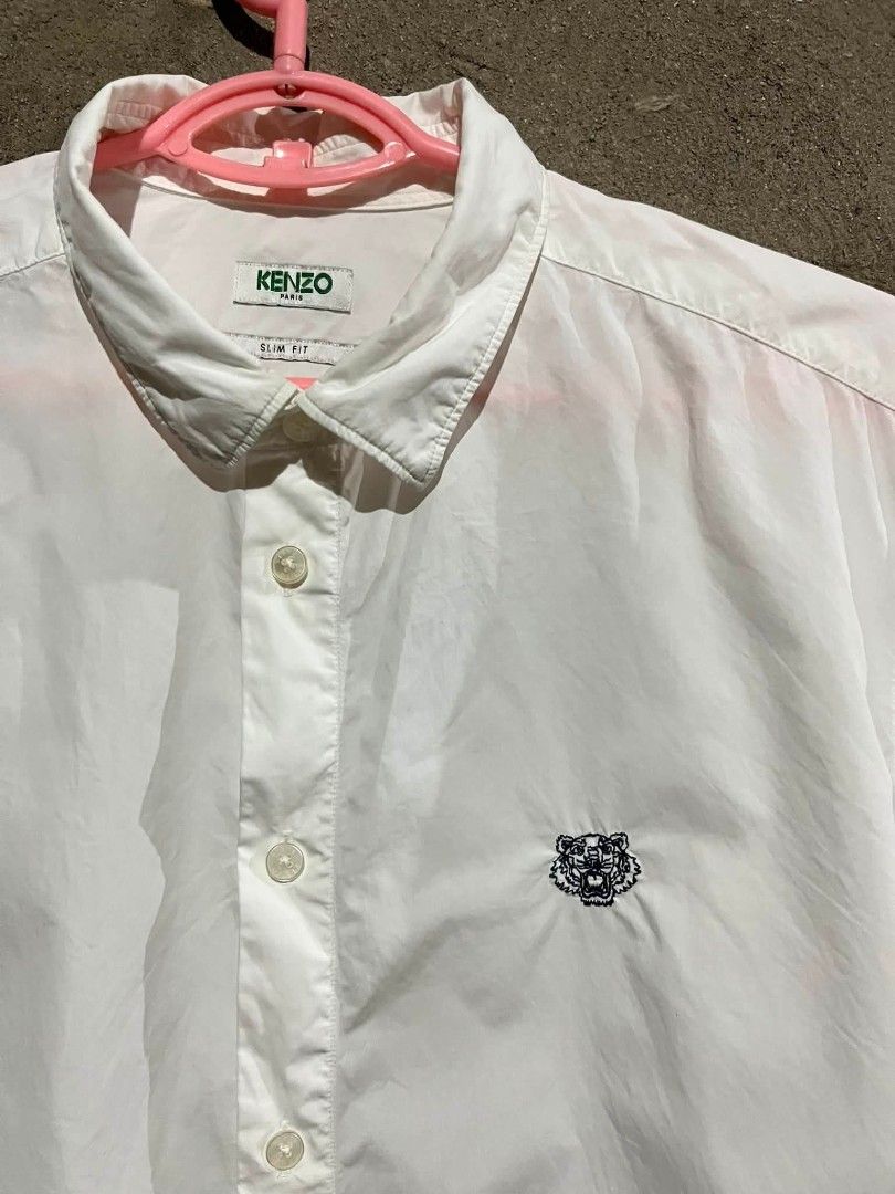 KENZO Tiger Crest Button-Down Shirt White (Category: Tshirts & Polo Shirts ) located in Sindangan. Submitted by waterbop (Listing ID 1468562095, Image 2). Description: EXCELLENT CONDITION SLIM FIT ON TAG ( FIT TO LARGE ) 10/10 COLOR RATE NO ISSUE LOC ZAMBOANGA DEL NORTE.