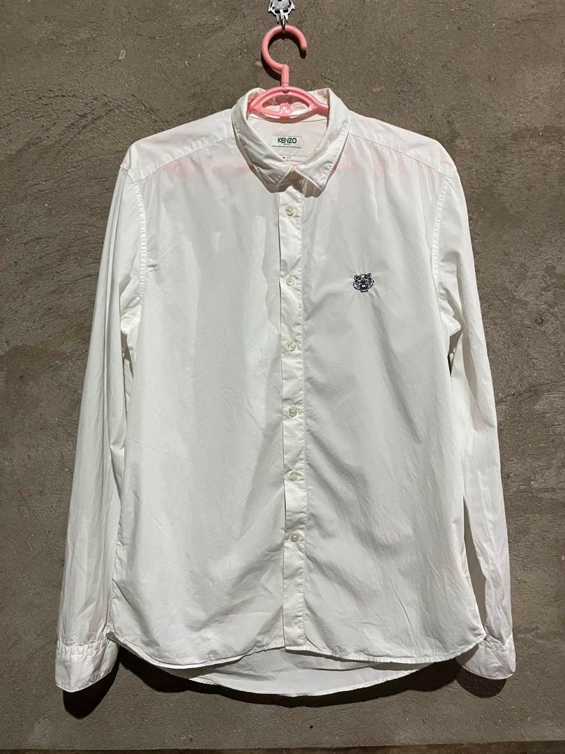 KENZO Tiger Crest Button-Down Shirt White (Category: Tshirts & Polo Shirts ) located in Sindangan. Submitted by waterbop (Listing ID 1468562095, Image 1). Description: EXCELLENT CONDITION SLIM FIT ON TAG ( FIT TO LARGE ) 10/10 COLOR RATE NO ISSUE LOC ZAMBOANGA DEL NORTE.