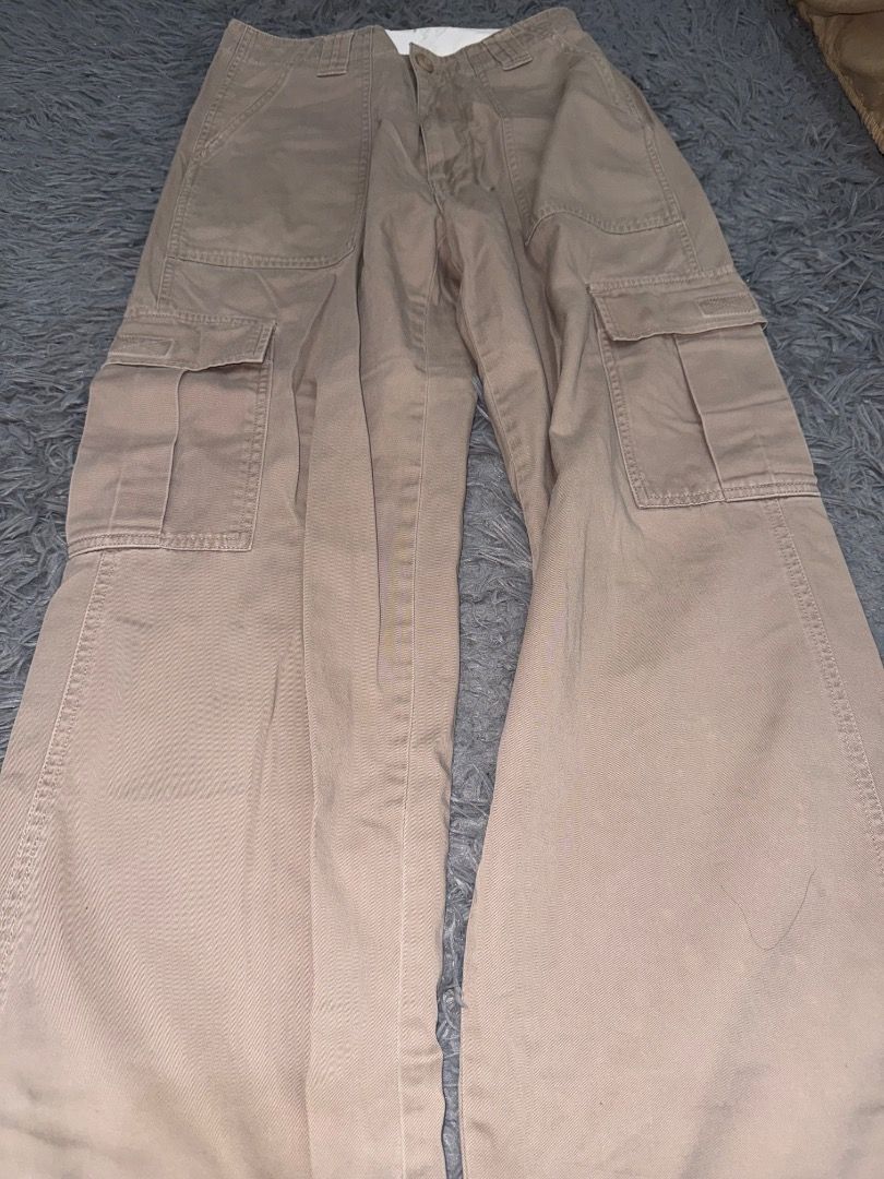 Khaki Utility Cargo Pants with Pockets (Category: Jeans) located in Quezon City. Submitted by ashhaul (Listing ID 1468571045, Image 2). Description: - Style: Relaxed wide-leg fit, streetwear essential - Pockets: Large side utility pockets and deep front pockets - Closure: Button fly - Material: Durable cotton twill that holds its structure - Color: Neutral earthy khaki that matches everything.